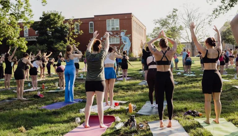 adults doing yoga